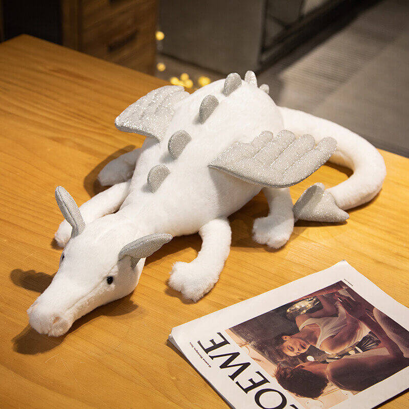 Flying dragon plush doll, perfect for toddlers and children, soft white with gray accents, great for playtime.