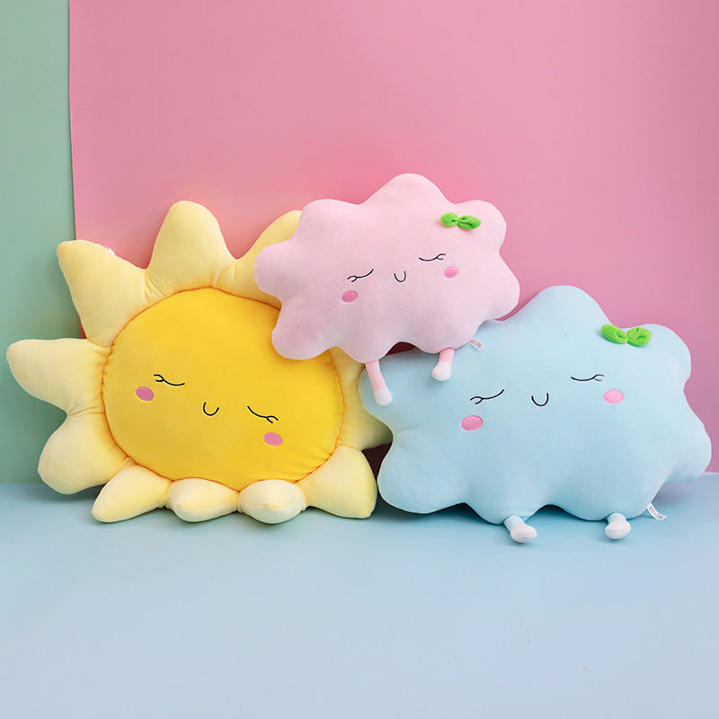 Colorful playful pillows shaped like a sun and clouds, perfect for kids' rooms to add charm and comfort.
