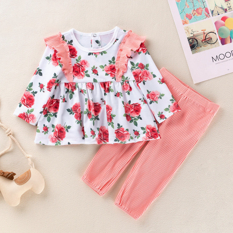 Adorable floral top with ruffle details and matching pink striped pants for girls, perfect for stylish casual outings.
